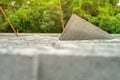 Closeup cement grey bricks out of the pile with blurred background at the construction site