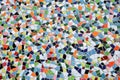 Closeup of ceramic mosaic with countless multicolored tiles with different shapes form a coherent overall picture