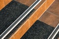 Closeup of ceramic tiles covering porch stairs with rubber anti slippery stripes on it