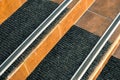 Closeup of ceramic tiles covering porch stairs with rubber anti slippery stripes on it