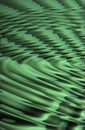 Closeup of CGI green ripple effect background for computer or digital use. Glowing liquid surface with a abstract