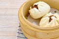 Closeup of Char siu bao in a wooden bowl. Chinese cuisine. Royalty Free Stock Photo
