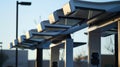 A closeup of the charging stations solar panels capturing the suns rays as it converts them into renewable energy for Royalty Free Stock Photo