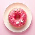 Closeup a charming pink donut with white sprinkles. Royalty Free Stock Photo