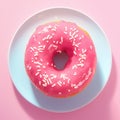 Closeup a charming pink donut with white sprinkles. Royalty Free Stock Photo