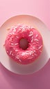 Closeup a charming pink donut with white sprinkles. Royalty Free Stock Photo