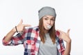 Closeup of cheeky teen girl blowing bubblegum and pointing at it