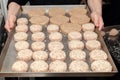 Closeup chef cook hands hold chicken cutlets for burgers. Bread crumbs on metal kitchen tray. Ingredients. Concept restaurant Royalty Free Stock Photo