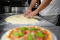 Closeup chef hands mixing flour for kneading pizza dough Royalty Free Stock Photo