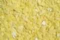 Closeup chemical ingredient on laboratory table Top View. Sodium sulfide flakes, a yellow appearance owing to the presence of Royalty Free Stock Photo