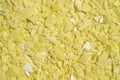 Closeup chemical ingredient on laboratory table Top View. Sodium sulfide flakes, a yellow appearance owing to the presence of