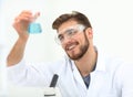 Closeup. chemist holding a beaker with a solution
