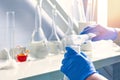 A closeup of a chemist in a laboratory analyzing