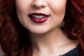 Closeup cherry lips. girl with red hair. the lower
