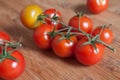 cherry tomatoes on wooden cutting board in bambou tex