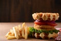 Closeup chicken burger waffle sandwich with french fries
