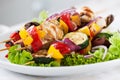 Closeup of chicken skewers or shashlik with grilled vegetables Royalty Free Stock Photo