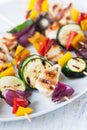 Closeup of chicken skewers or shashlik with grilled vegetables Royalty Free Stock Photo