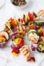 Closeup of chicken skewers or shashlik with grilled vegetables Royalty Free Stock Photo