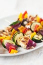 Closeup of chicken skewers or shashlik with grilled vegetables Royalty Free Stock Photo