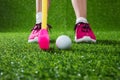 Closeup of a child golfer with putter and ball Royalty Free Stock Photo