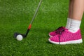 Closeup of a child golfer with putter and ball Royalty Free Stock Photo