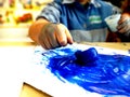 Closeup of children hands painting during a school activity - ice painting - learning by doing, education and art, art therapy Royalty Free Stock Photo