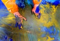 Closeup of children hands painting during a school activity - learning by doing, education and art, art therapy concept