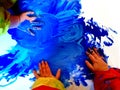 Closeup of children hands painting during a school activity - learning by doing, education and art, art therapy concept