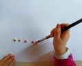 Closeup of children hands painting during a school activity - learning by doing, education and art, art therapy concept Royalty Free Stock Photo