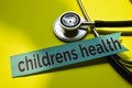 Closeup children health with stethoscope concept inspiration on yellow background