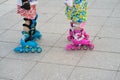 Closeup children roller skating. Learning to skate outdoor