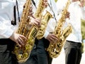 Closeup of a children`s orchestra playing on musical wind instru Royalty Free Stock Photo