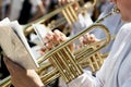 Closeup of a children`s orchestra playing on musical wind instru Royalty Free Stock Photo