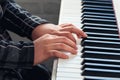 Closeup of childs hands playing on electric piano