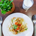 Closeup of chinese food, Fried noodle mixed with egg and vegetables on white plate Royalty Free Stock Photo