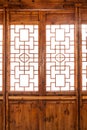 Closeup Chinese old wooden frame door with decorative pattern under the sunshine Royalty Free Stock Photo