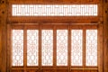 Closeup Chinese old wooden frame door with decorative pattern under the sunshine Royalty Free Stock Photo