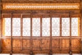 Closeup Chinese old wooden frame door with decorative pattern under the sunshine