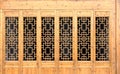 Closeup Chinese old wooden frame door with decorative pattern under the sunshine Royalty Free Stock Photo