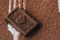 Closeup chocolate bar and cocoa powder on white background Royalty Free Stock Photo