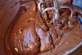 Closeup of chocolate cake mix with beaters.