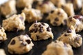 Closeup of chocolate chip cookies dough on baking tray ready for baking Royalty Free Stock Photo
