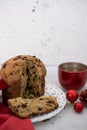 closeup chocolate-chips Panettone and cup of tea on white table with decorations Royalty Free Stock Photo