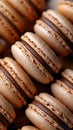 Closeup of chocolate macarons lined on a table, tempting dessert finger food Royalty Free Stock Photo