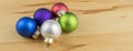 Closeup of Christmas baubles on wooden background with copy space Royalty Free Stock Photo