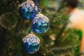 Closeup of Christmas holiday tree decorations with bokeh on background Royalty Free Stock Photo