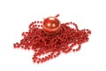 Closeup of a Christmas red pearl beaded chain with a red ball isolated on a white background