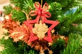 Closeup Christmas star ornaments  and  Christmas Trimmings decorated on pine tree background Royalty Free Stock Photo