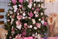 Closeup of Christmas tree decorated with white and pink baubles and garland, copy space. Christmas decorations. Holiday background Royalty Free Stock Photo